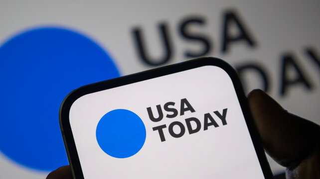 Usa today media logo with blue circle on digital device for news reporting and journalism industry concepts.