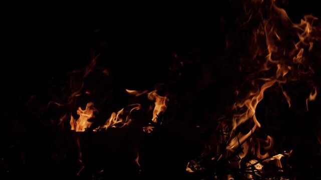 Fire flames flowing upward. Fire burning strong energy. Fire blazing cinematic flames. Fire texture for creative use.