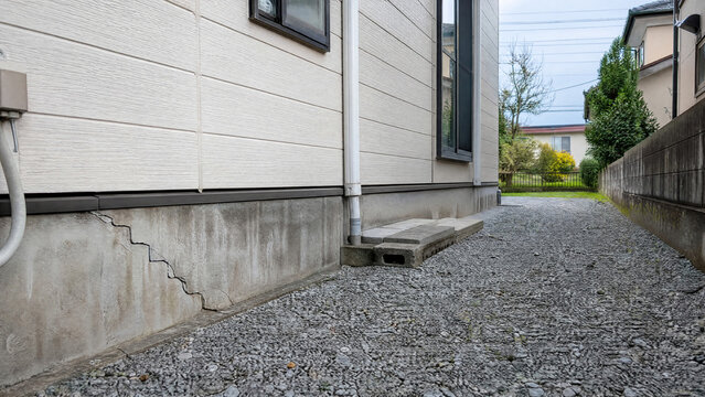 Stepped crack in the foundation of a Japanese house - home inspection - copy space