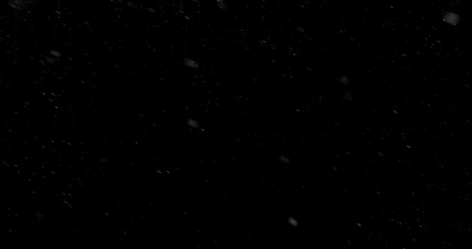 Freeze motion of Falling Realistic Snow Captured on a Pure Black Background. Perfect as a VFX or Compositing Overlay for Winter Atmospheres and Visual Effects.