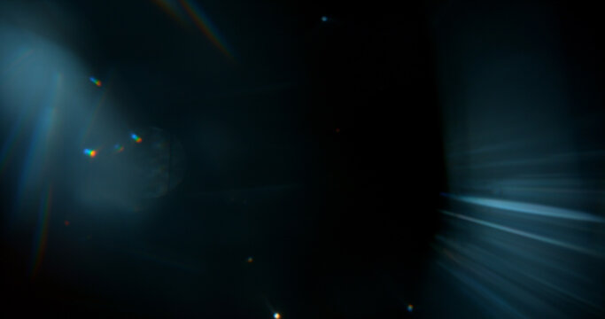 Abstract cinematic lens flare with soft bokeh circles and subtle light reflections. Atmospheric optical effect background ideal for overlays, visual effects, film production and creative design.
