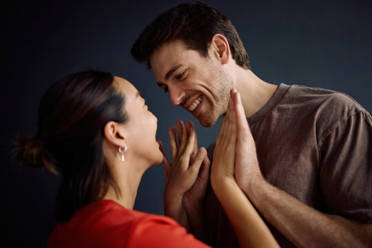 Happy couple in love into each other&rsquo;s eyes.