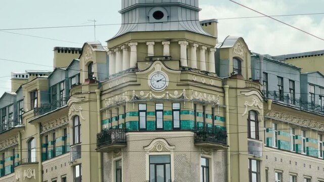 A historic building tower passes by a car window in Saint Petersburg. This fleeting architectural view evokes a feeling of nostalgic wonder and quiet excitement.