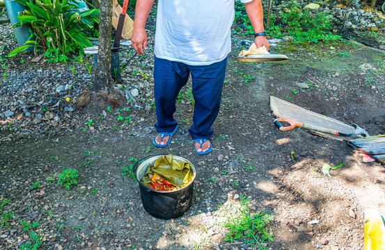 Traditional underground cooking in Ek Balam Yucatan Mexico