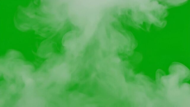 White smoke cloud isolated on bright green background with soft swirling shapes and texture