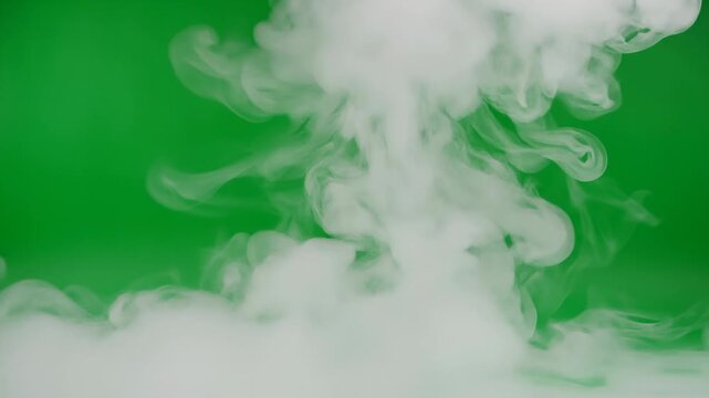 White smoke or vapor rising against a vibrant green background in soft swirling patterns
