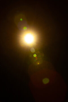Sun flare on the black background