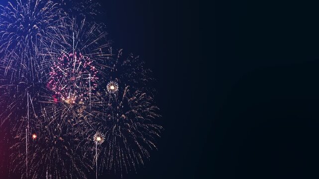 Gold and pink fireworks create a bright border beside an empty navy background. Perfect for countdown text, holiday advertising, party invitations, festival messages and cinematic celebration openers.
