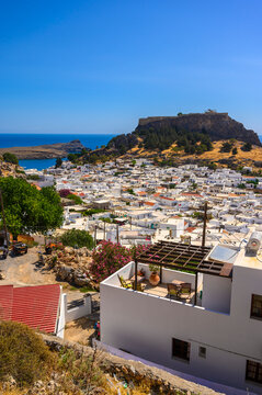 Traditional Lindos Harbor and Whitewashed Village on Rhodes Island, travel destination in Greece;