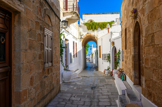 Traditional Lindos Harbor and Whitewashed Village on Rhodes Island, travel destination in Greece;
