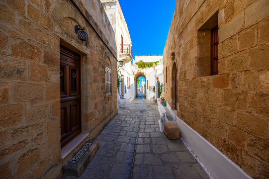 Traditional Lindos Harbor and Whitewashed Village on Rhodes Island, travel destination in Greece;