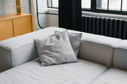 Close Up of Grey Pillows on Modern Sectional Sofa