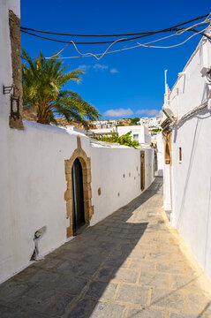 Traditional Lindos Harbor and Whitewashed Village on Rhodes Island, travel destination in Greece;