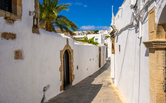 Traditional Lindos Harbor and Whitewashed Village on Rhodes Island, travel destination in Greece;
