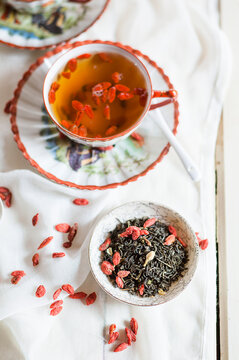 Cup of green jasmine tea with dried Goji berries, Lycium barbarum