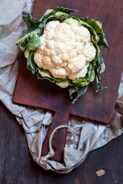 White cauliflower on chopping board