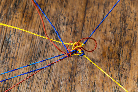 Different strings knotted