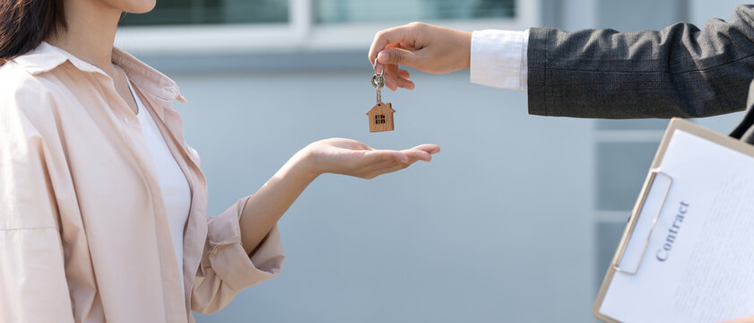 lease, rental and selling home. Real estate agent hold key for new house or real estate. rent house, Sales, loan credit financial, insurance, Seller, dealer, installment,  buy, sell, move in