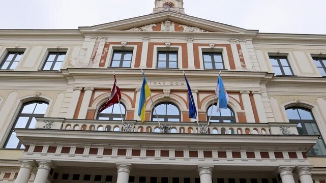 Facade of Riga Town Hall with flags at Ratslaukums in Riga Old Town, Latvia