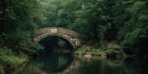 Fototapeta premium Stone Arch Bridge Reflected in Calm River Surrounded by Lush Green Forest