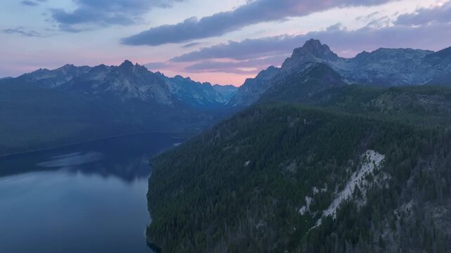 Aerial view of Redfish Lake surrounded by the Sawtooth Mountains at twilight in Stanley, Idaho, United States.