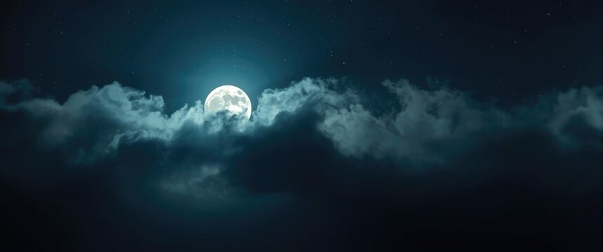 Full Moon Glowing Behind Dark Clouds in Night Sky