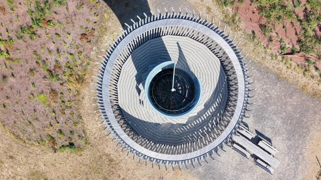 Aerial view of Naturum Getteron observation tower with its circular wooden deck and central spiral staircase in Varberg, Hallands lan, Sweden.