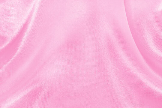 Pink fabric cloth texture for background and design art work, beautiful crumpled pattern of silk or linen.