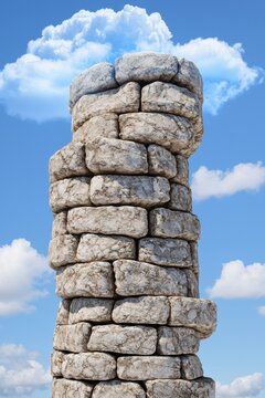 Historic stone tower stretching high into a clear blue sky adorned with soft fluffy clouds
