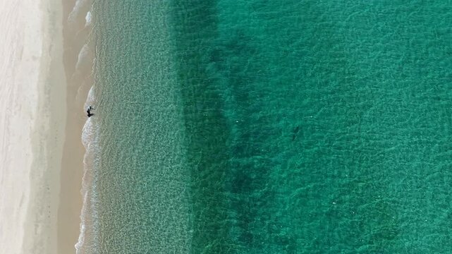 Aerial view of a fly fisherman on the beach in La Ventana, Baja California Sur, casting into the Sea of Cortez.