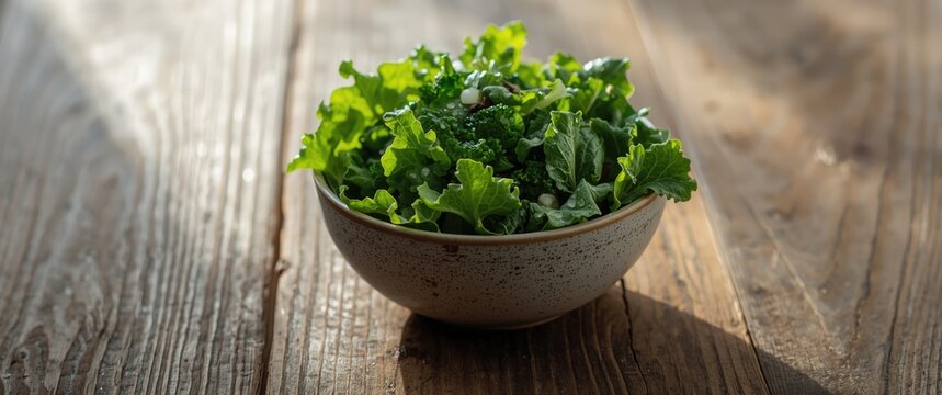 Fresh Leafy Greens in a Bowl on a Rustic Wooden Table