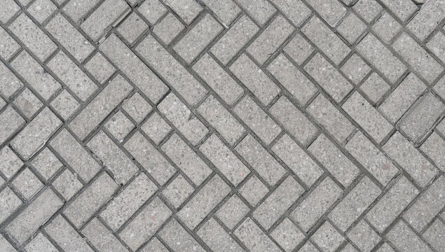 Textured Gray Brick Paving in a Herringbone Pattern