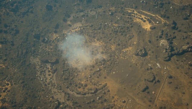 Aerial View of Burnt Landscape with Smoke - Dry Terrain, Circle Patterns, Natural Contrast