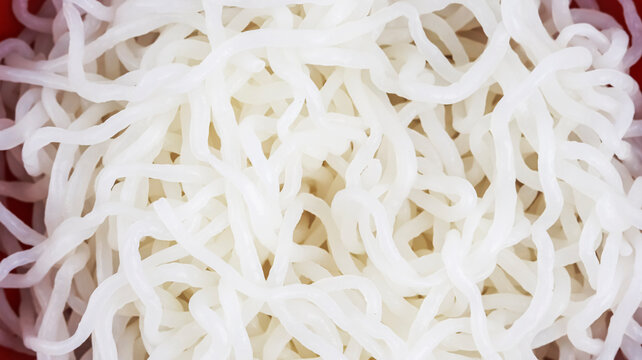 Macro Close-up Texture Background of Cooked White Shirataki Noodles