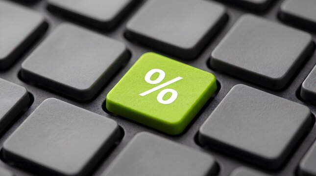 Green percentage key on a modern dark computer keyboard for online shopping discounts, financial savings, e-commerce promotions, and seasonal sales growth concept