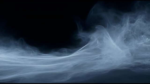 Wisps of white smoke rising against a solid black background