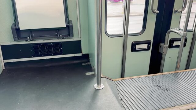 Interior of Empty Helsinki Tram with Doors and Handrails