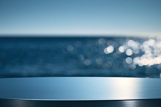 Smooth, reflective surface in foreground with blurred ocean and sky behind