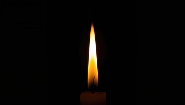 Candle Flame Flickering in Darkness with Warm Glow