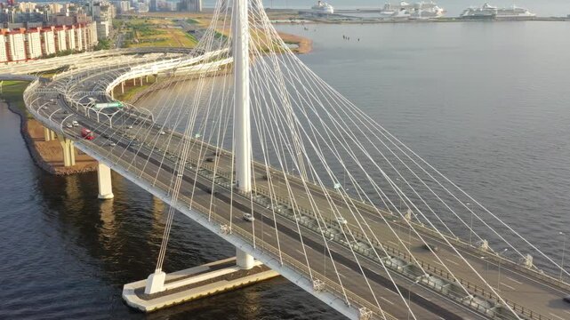 Aerial view of the cable-stayed Western High-Speed Diameter bridge with highway traffic crossing the water in Saint Petersburg, Saint Petersburg, Russia.