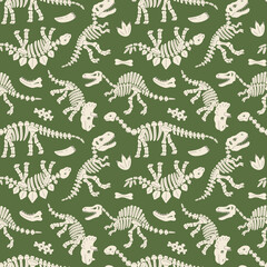 Dinosaur Skeletons and Bones on Green Seamless Pattern © draftsndoodles