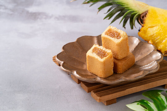 Traditional Taiwanese pineapple cake pastry served on ceramic plate.