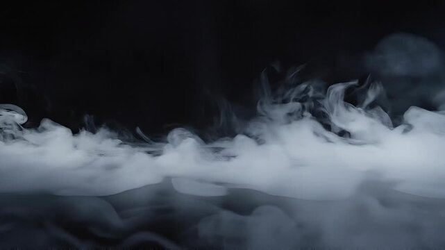 White smoke or mist on black background with soft swirling patterns and foggy atmosphere