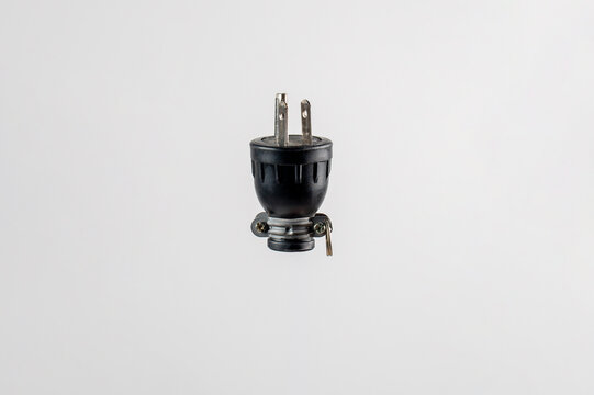 3 Pin United States Power Plug Electrical Plug and hand on white background.