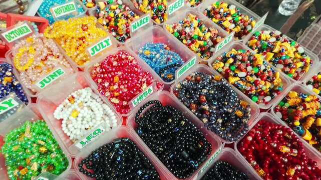 Handmade gemstone bracelets are arranged by zodiac signs for sale