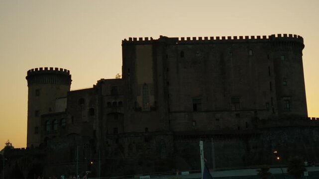 Silhouette of the Angevin Castel Nuovo in Naples at sunset