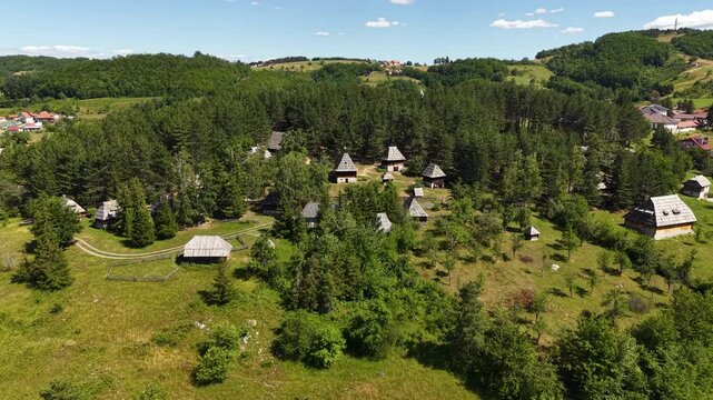 Drone Shot of Sirogojno Old Village Open Air Museum, Serbia. Old Houses and Farming Buildings on Sunny Summer Day