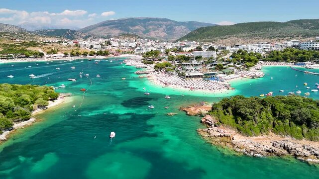 Aerial view of Ksamil beach and islands, crystal clear sea, Ionian Sea, Saranda, Albania. Drone view from above. Sea and coast with sandy beach. Summer destination on the Mediterranean Sea, Europe
