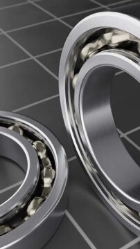 Close-up view of precision ball bearings on a grid surface
