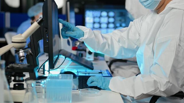 Female Scientist Looking Under Microscope in medicine chemical biology medical science experiment technology biotechnology analysis